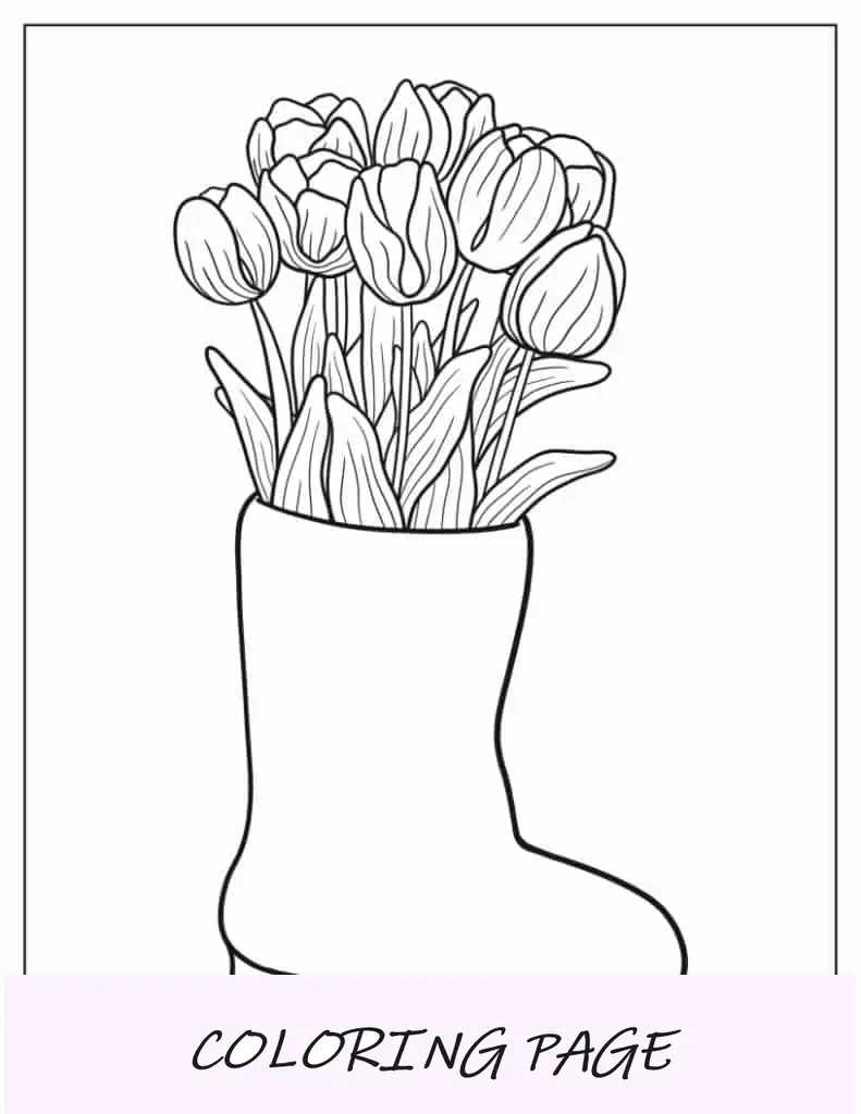 Tulpenblüten wachsen aus einem Stiefel